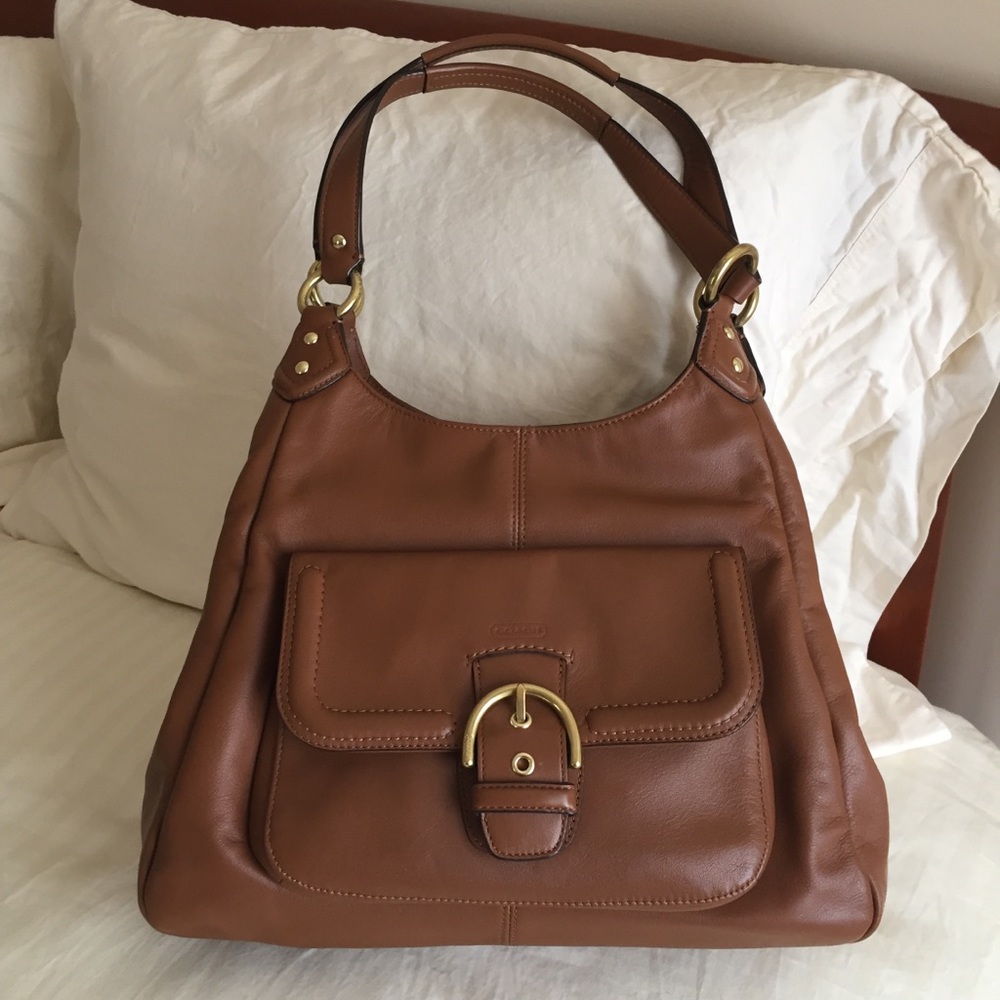 Coach bag with three large compartments.